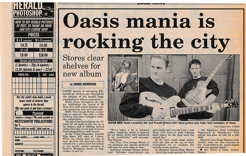 You never know who you might run into in a music store, thinks Russ (R), in this August 20, 1997 newspaper clipping.